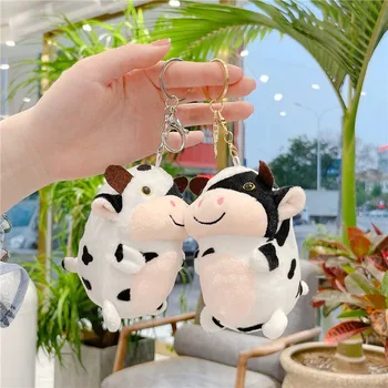 10cm Mini kawaii sevimli küçük inek peluş kolye çanta anahtar aksesuarları Villus oyuncak siyah ve beyaz benekli inek eğlenceli araba aksesuarları